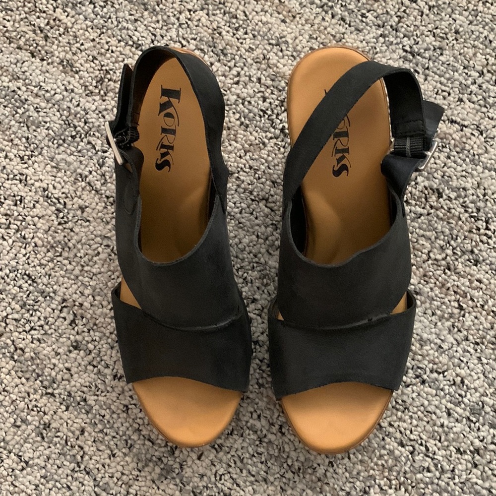 Korks high heels sandals.